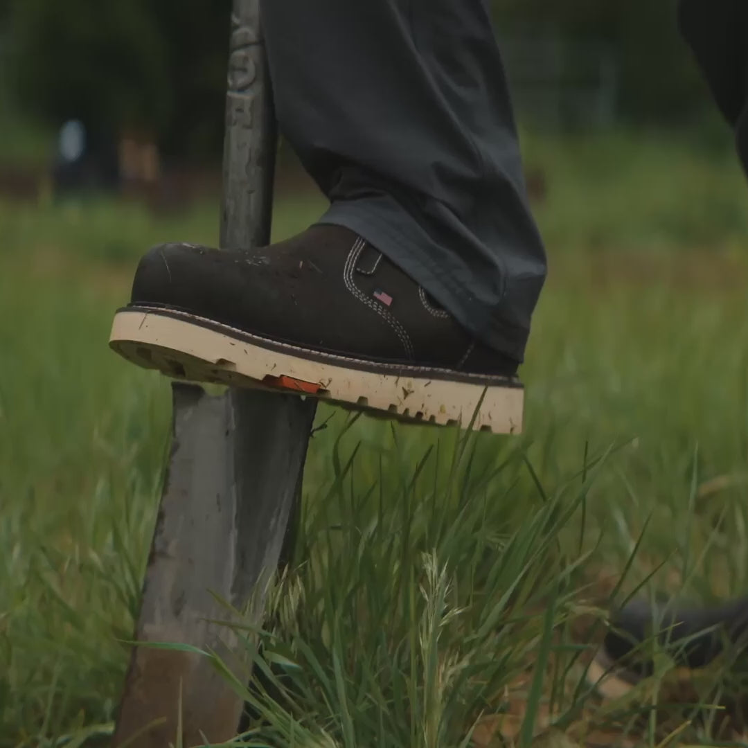 video of the BRUNT 6 inch usa welted slip on work boot in dark brown digging dirt on jobsite