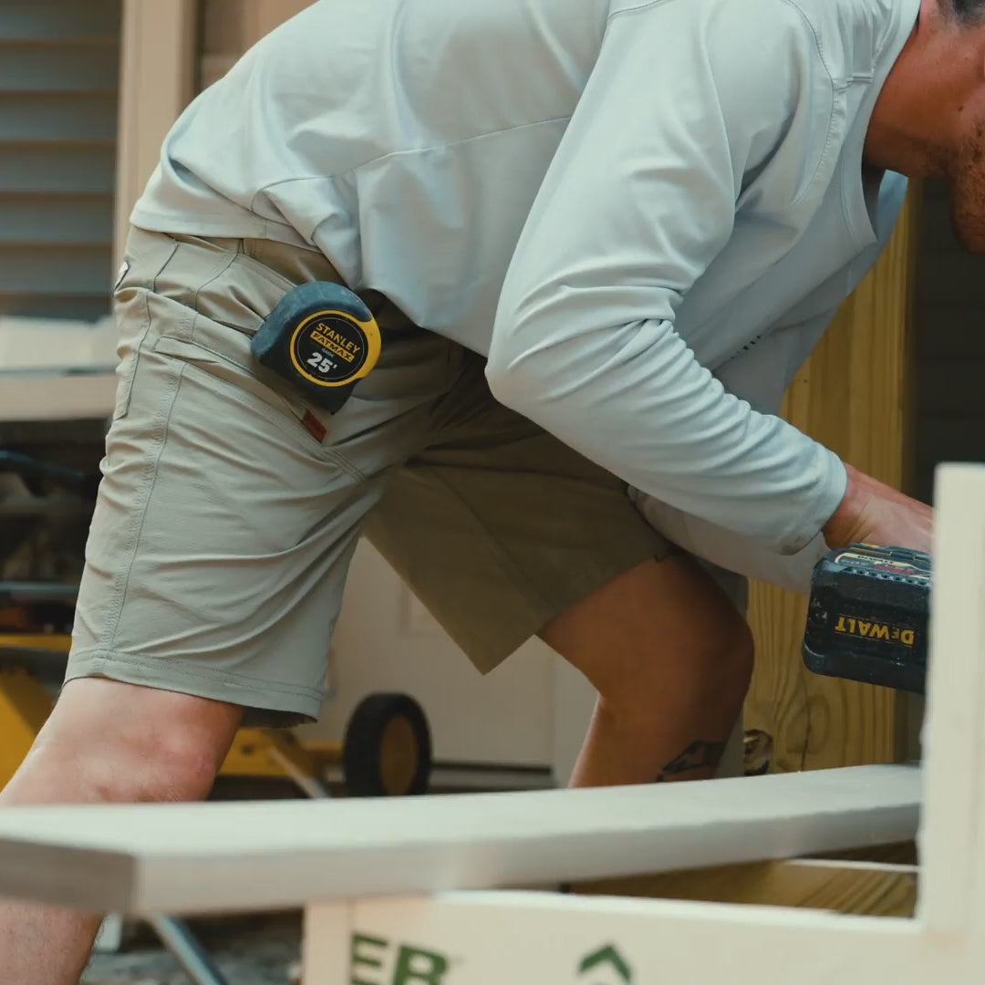 Video of man on jobsite wearing BRUNT 11 inch lightweight breathable costello work shorts in khaki