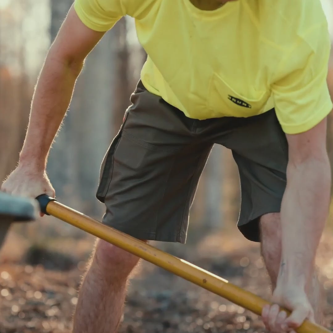 video of man on jobsite wearing BRUNT abrasion resistant cargo work shorts in brown