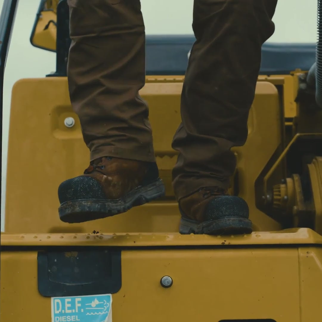 Video of man on jobsite walking down machinery in BRUNT 6 inch waterproof welted composite toe mulder work boot with 90 degree defined heel in brown
